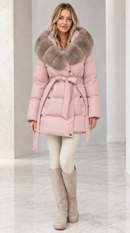 Model wearing Blush Pink belted quilted puffer coat with plush faux fur collar