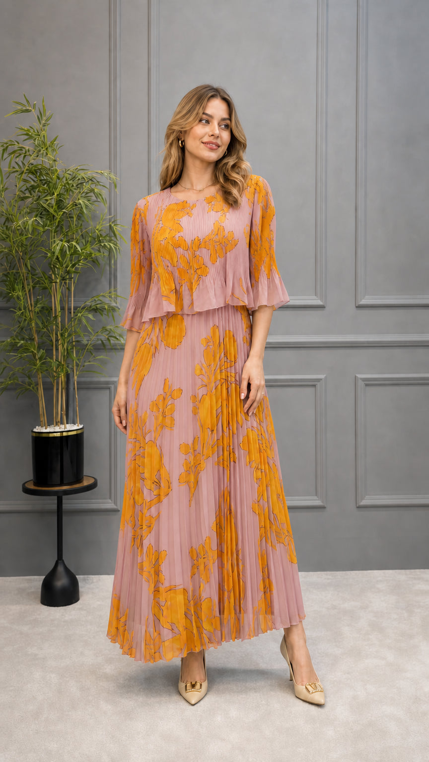 Model wearing dusty pink floral pleated maxi dress with flounce sleeves