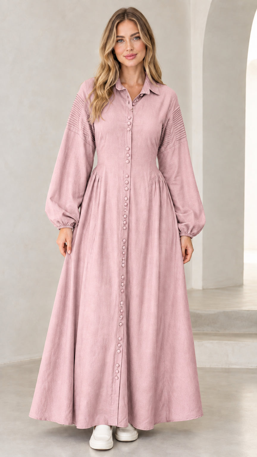 Front view of woman wearing dusty pink long sleeve button-down maxi dress