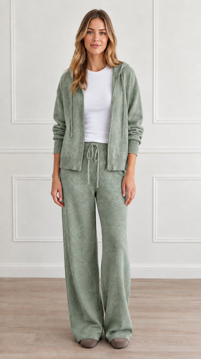 Front view of model wearing sage green knit hoodie and matching wide-leg lounge pants