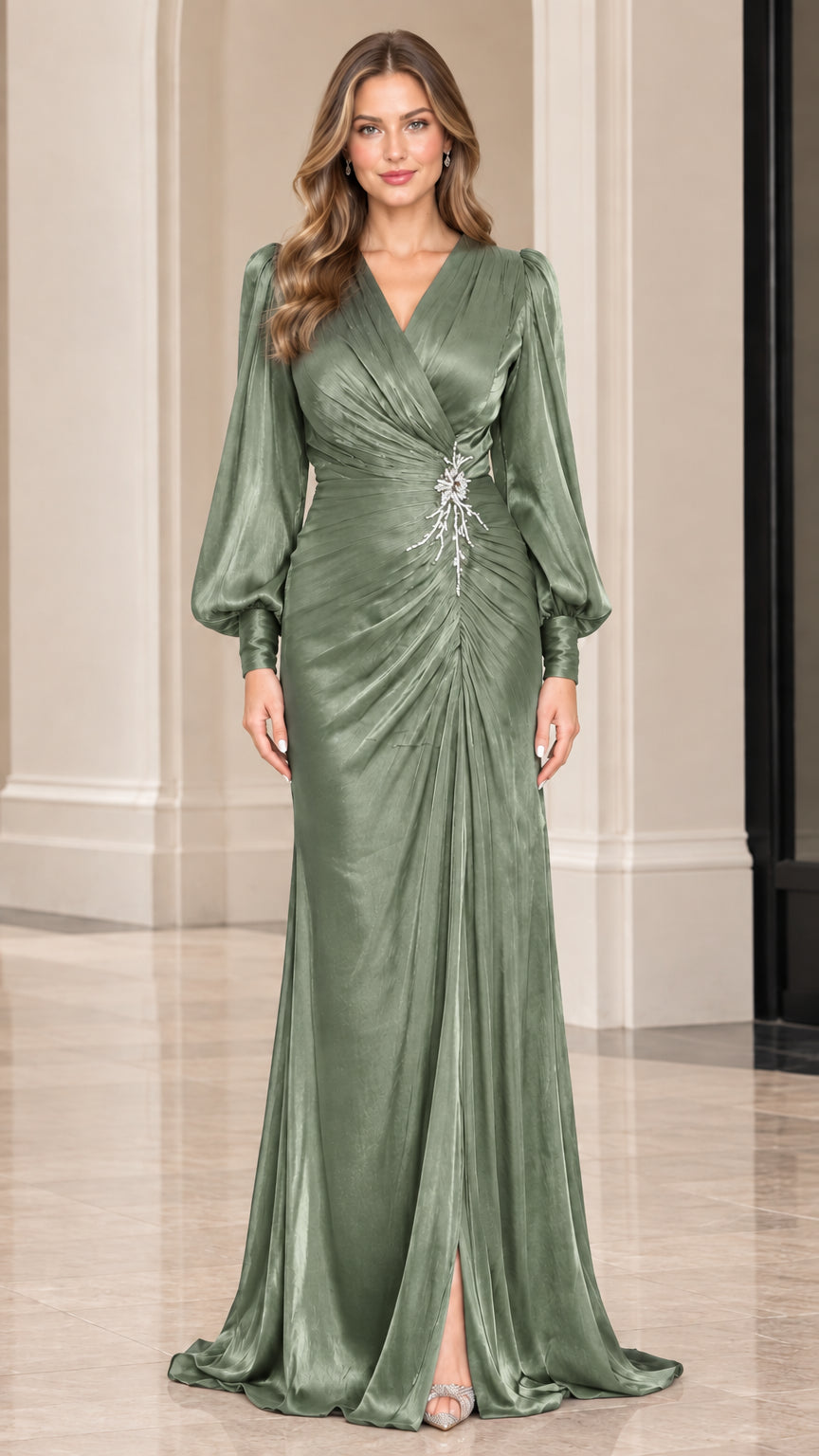 Front view of sage green long sleeve formal satin gown with crystal brooch