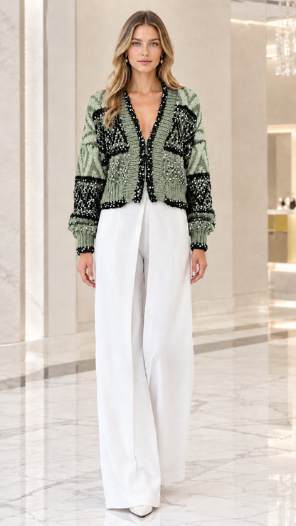 Model wearing sage green sequin embellished knit cardigan front view