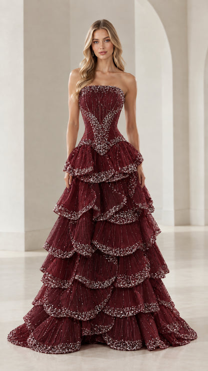 Front view of burgundy strapless tiered ruffle evening ball gown with sparkle trim