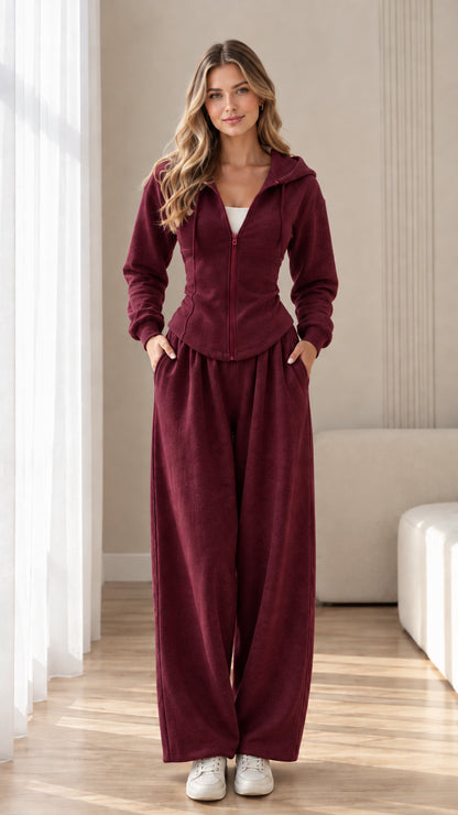 Front view of model wearing burgundy red corset hoodie and wide-leg sweatpants set