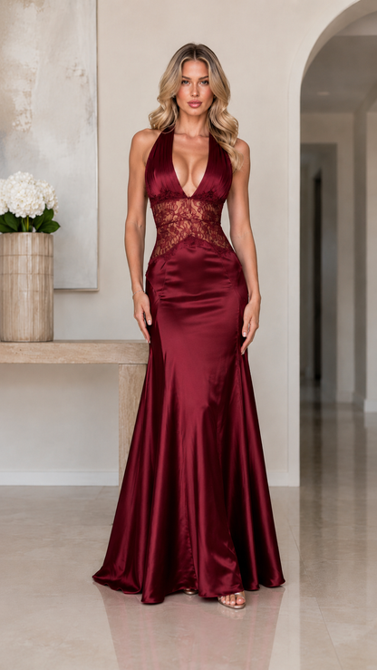 Front view of burgundy halter formal gown with lace waist and floor-length skirt