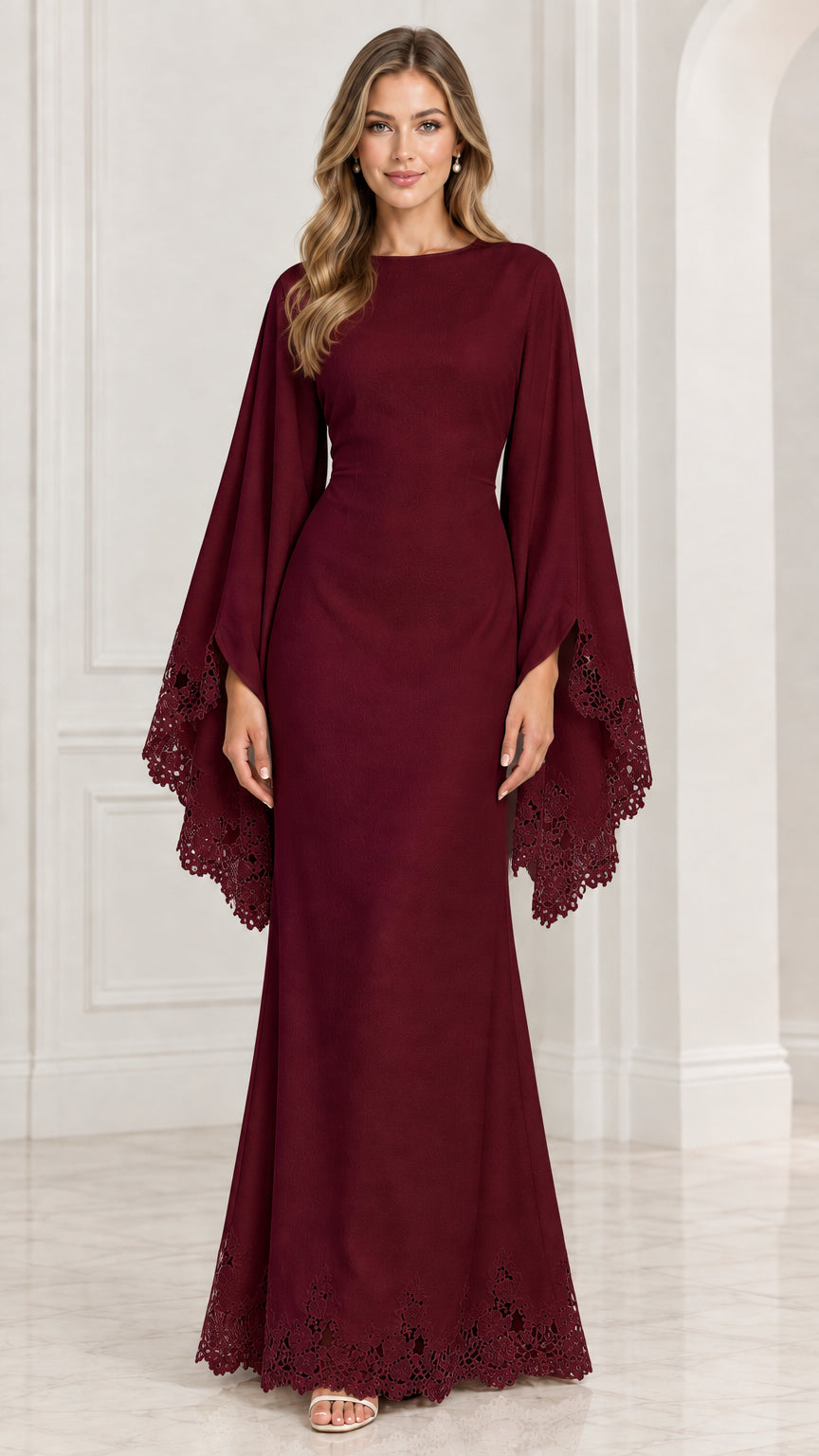 Front view of model wearing burgundy red cape sleeve formal gown with lace hem