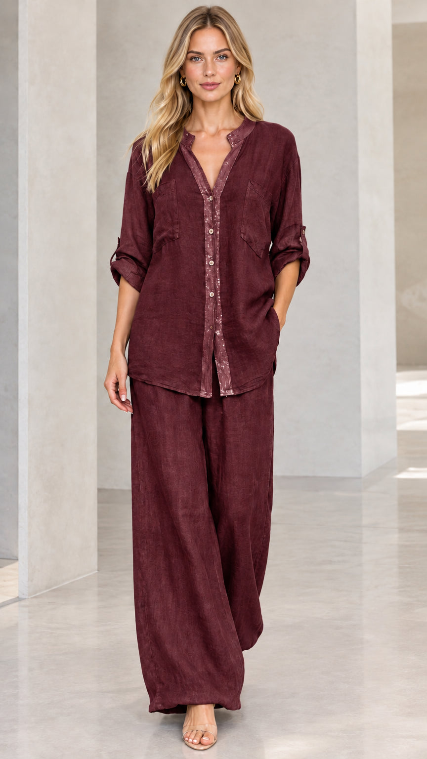 Full-length front view of burgundy wine button-down shirt and wide-leg trousers set