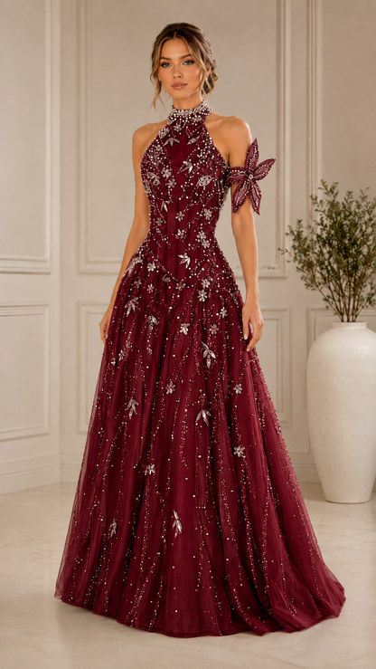Front view of burgundy embellished halter formal gown with full skirt