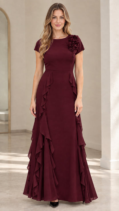 Front view of burgundy red floor-length formal dress with shoulder flower detail