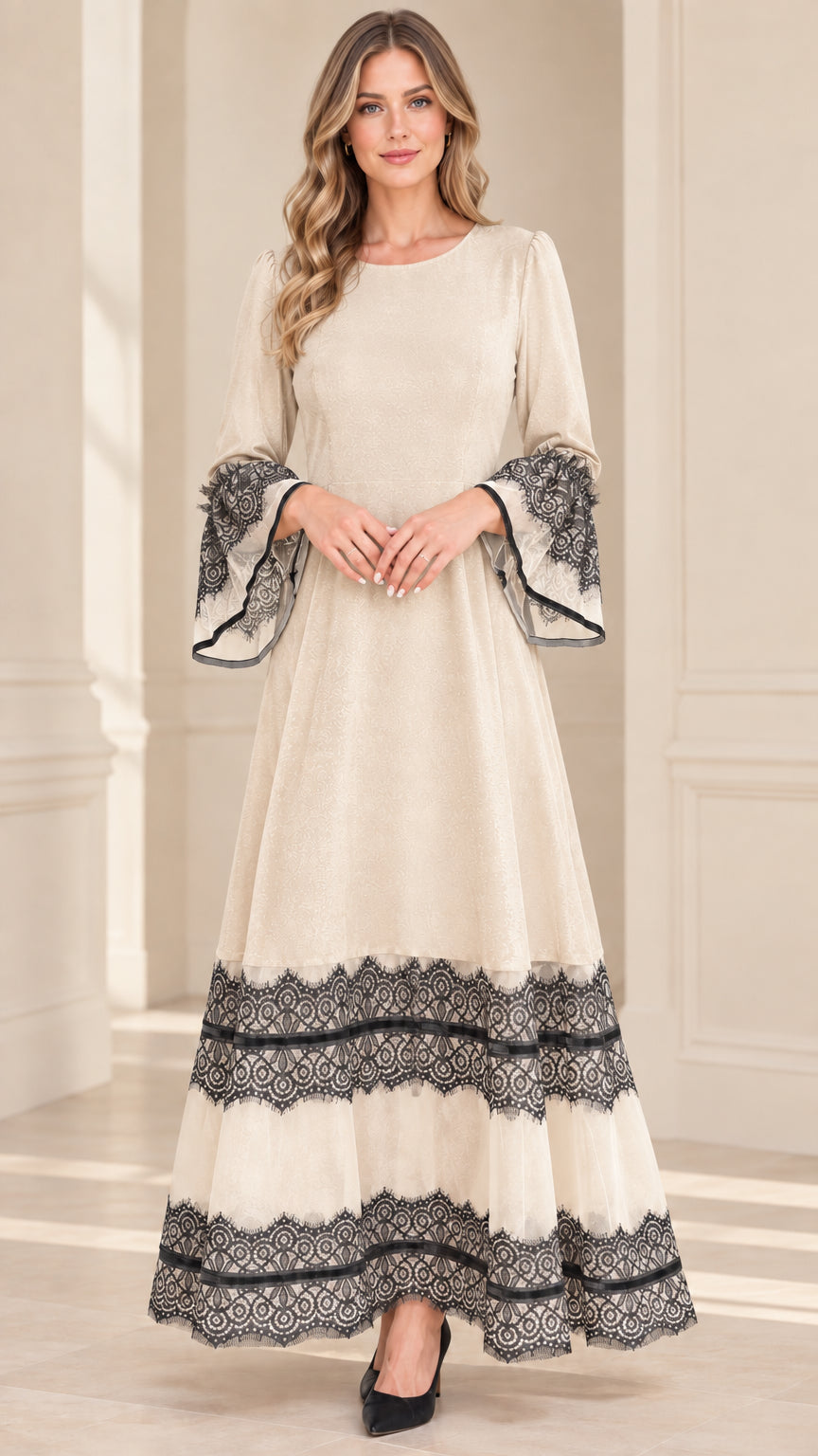 Model wearing champagne cream velvet maxi dress with contrast black lace trim