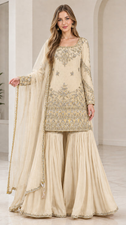 Full-length view of woman wearing Cream off-white embroidered sharara suit set