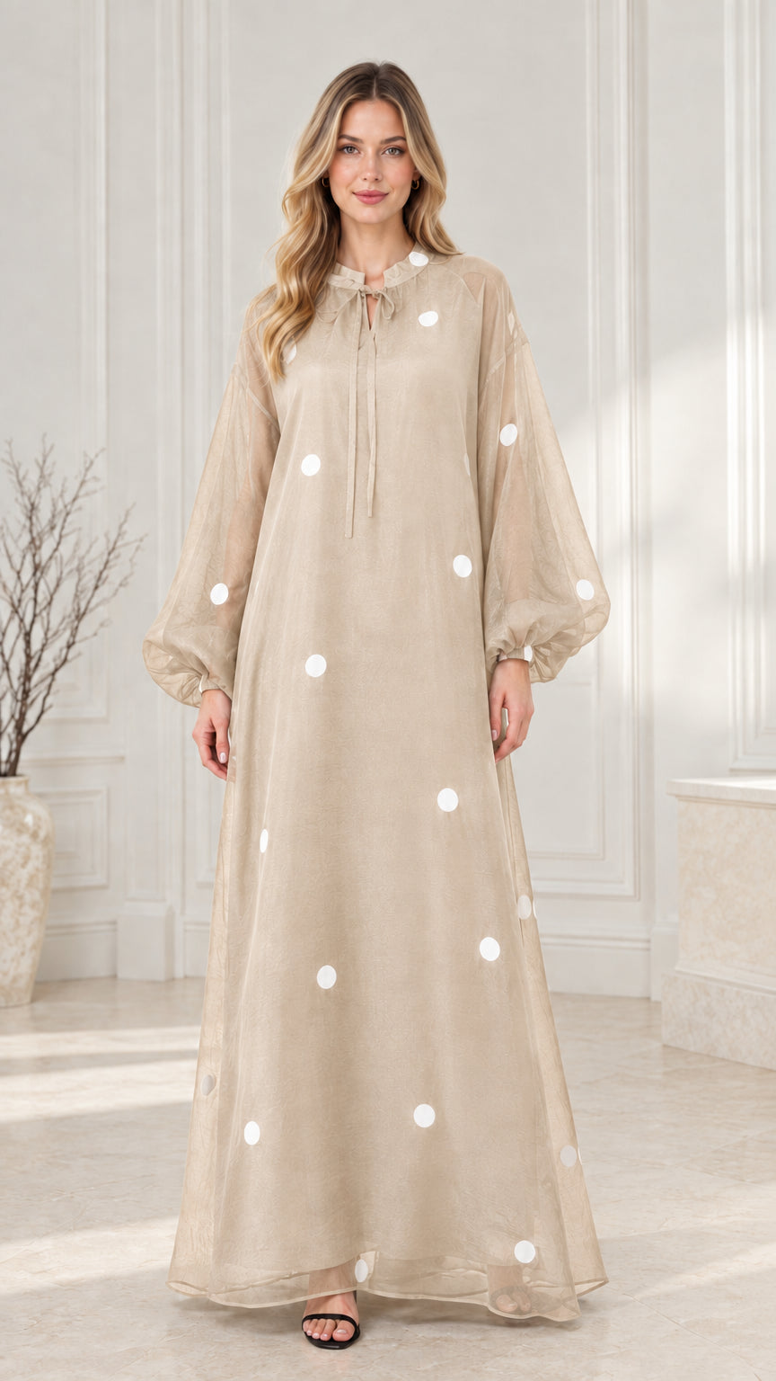 Front view of beige champagne polka dot balloon sleeve maxi dress