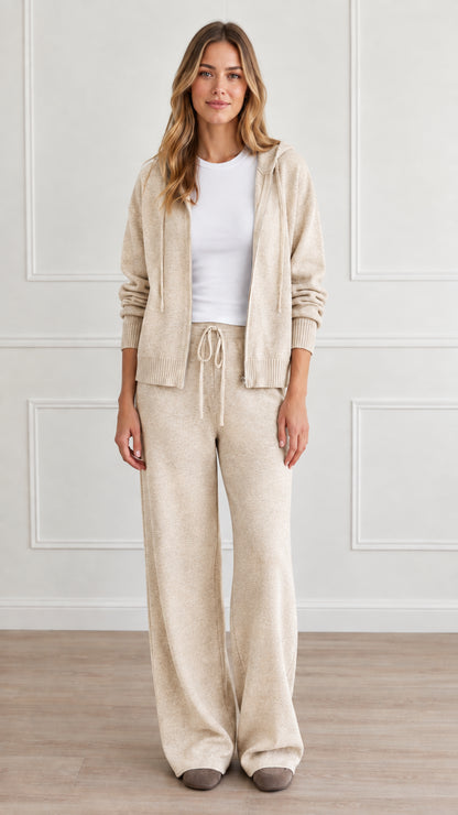 Front view of model wearing cream beige knit zip-up hoodie and wide-leg lounge pants set